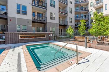 A small pool in a courtyard surrounded by buildings at Regatta Sloans Lake Apartments, Denver, CO